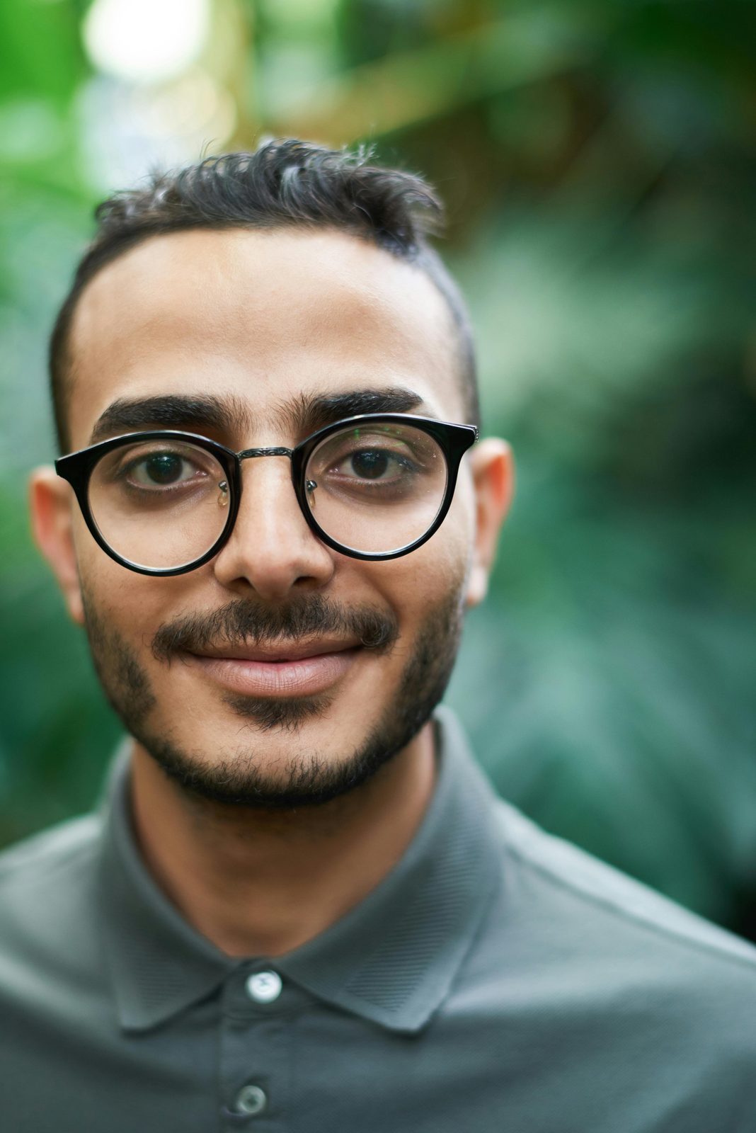 A person smiling outdoors, reflecting a calmer life after OCD therapy